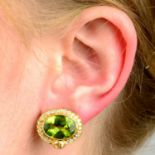 A pair of peridot and diamond cluster earrings.