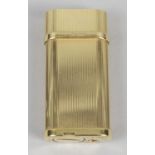 A gold plated Cartier cigarette lighter,