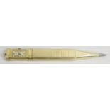 A gold plated Carl Bucherer combination propelling pencil and clock,