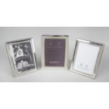 Three modern silver mounted photograph frames,