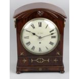 An early 19th century mahogany cased bracket style mantel clock,