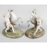 A pair of late 19th century continental porcelain figure groups,