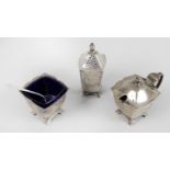 A matched silver condiment set,