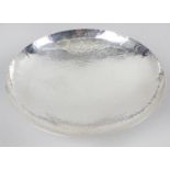 A cased modern silver dish, of circular footed form, with planished finish to the whole.