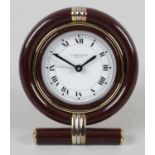 A Cartier quartz desk clock of circular shaped easel from,