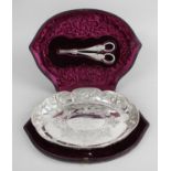 A cased Victorian silver fruit dish and grape scissors,
