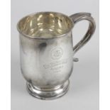 A 1920's silver mug,