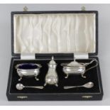 A cased modern silver condiment set,