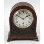 An Edwardian carved mahogany cased mantel clock,