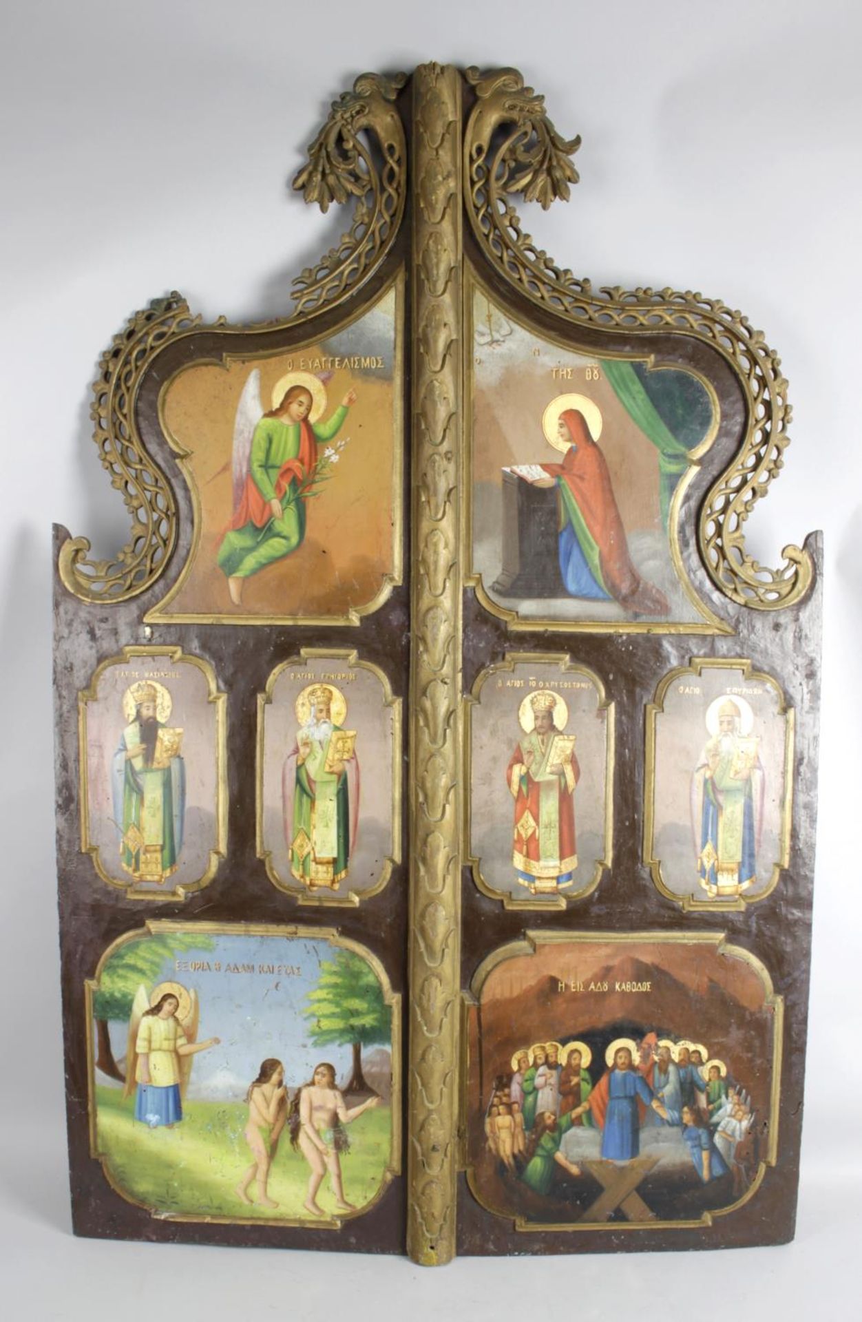 A 19th century carved wooden religious icon wall hanging,