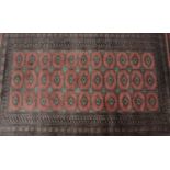 A 20th century machine woven wool work rug,