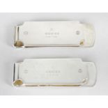 Two silver Gucci money clips,