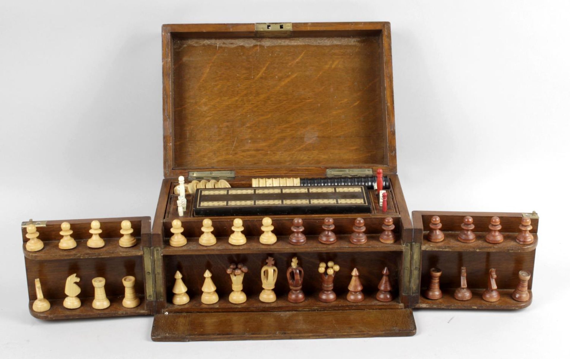 A late 19th century oak cased games compendium,