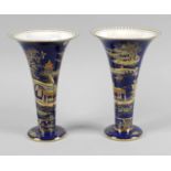 A pair of Carlton ware lustre glazed vases,