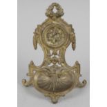 A late 19th century gilt cast pocket watch stand of floral shell and scroll form,