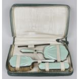 A 1930's silver and enamel part dressing table set,