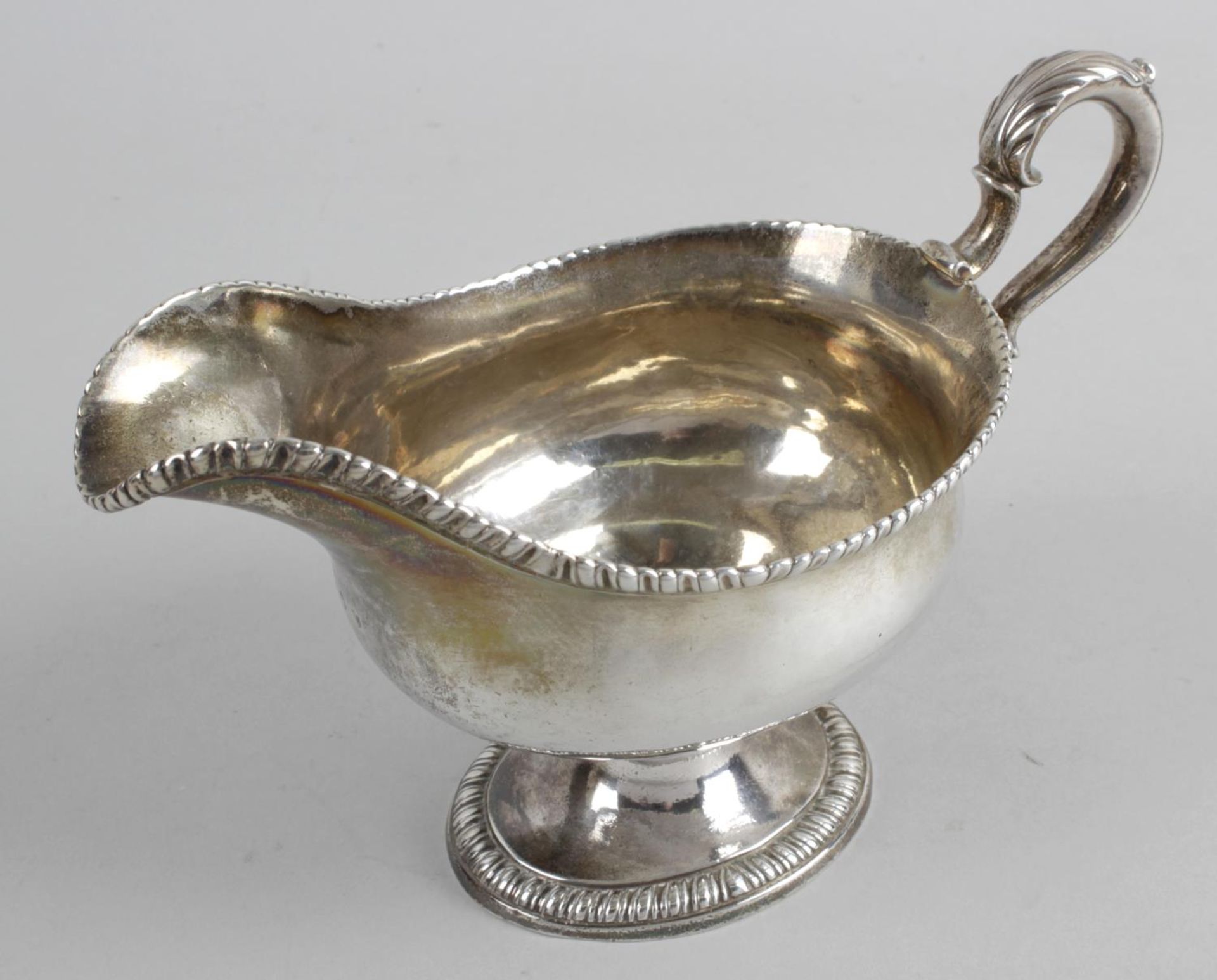 A late George II silver sauce boat,