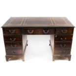 A reproduction twin pedestal mahogany veneered desk,