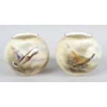 A pair of Royal Worcester bone china vases,