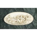 A fine 19th century carved ivory oval panel,