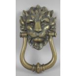 A solid cast brass door knocker, modelled as the head of a lion, 9.75 (25cm) high.