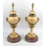 A pair of pink marble and gilt metal mounted table lamps,