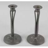 A pair of Art Nouveau Walker and Company Homeland hand beaten pewter candle sticks,