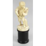 A 19th century carved ivory figure,