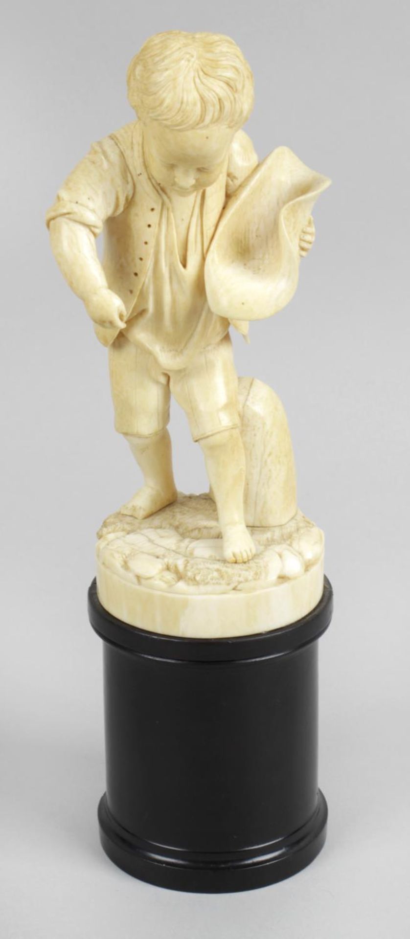 A 19th century carved ivory figure,