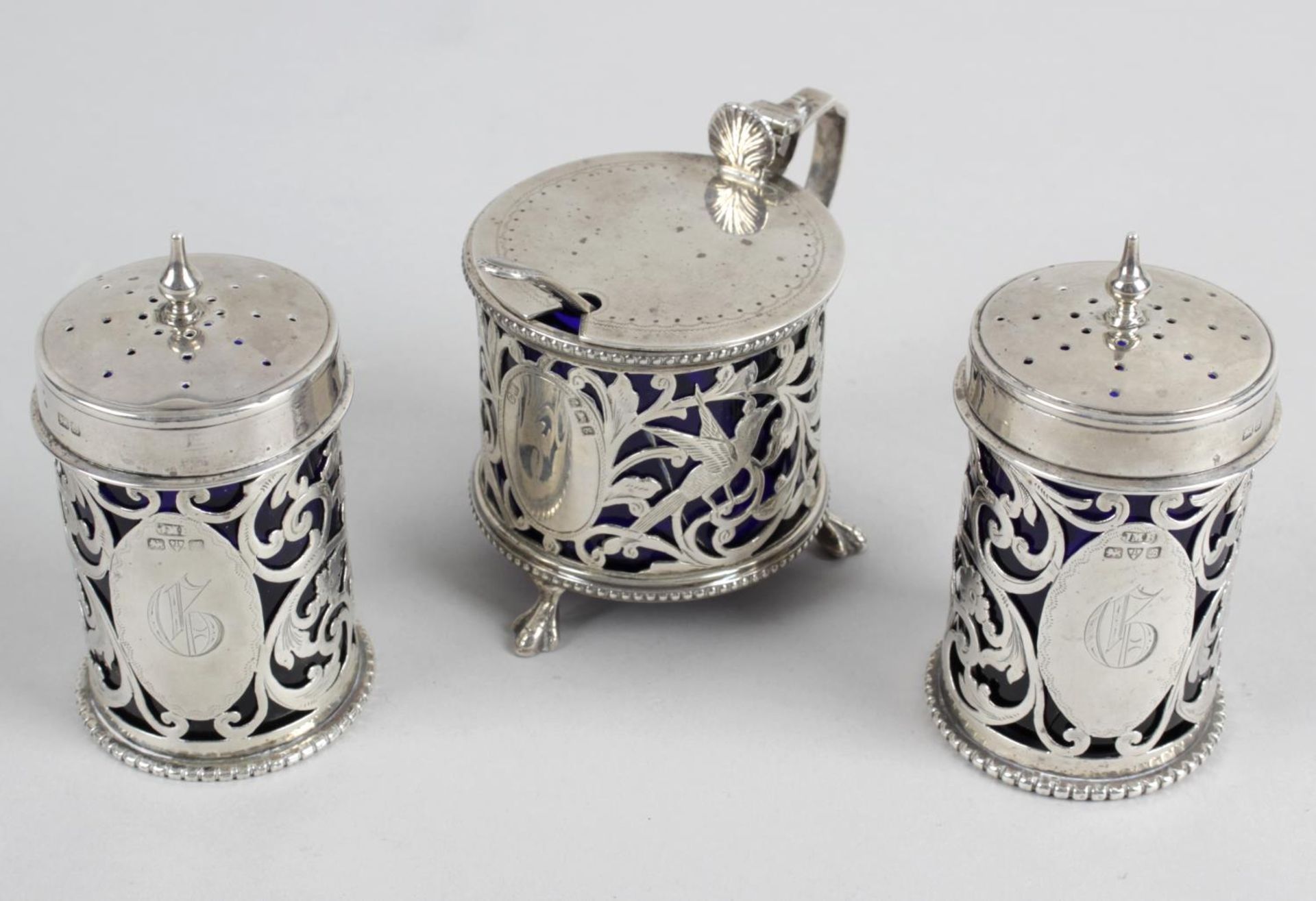 A matched Edwardian silver condiment set,