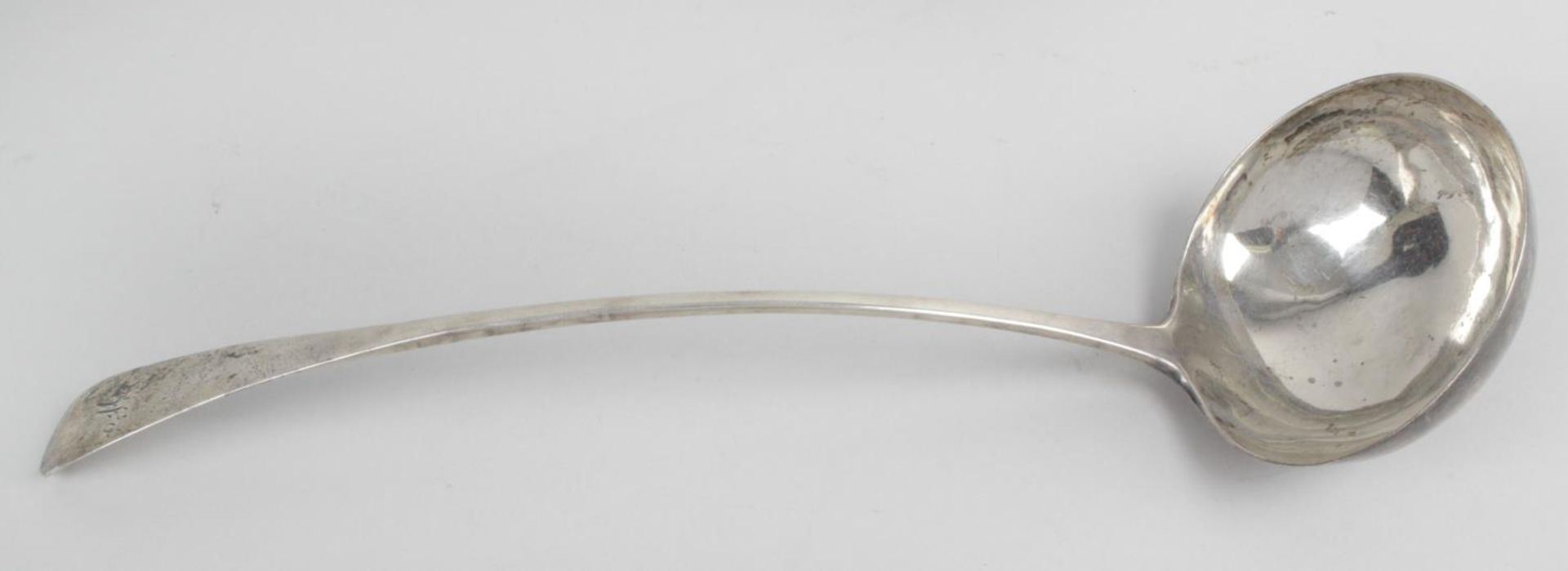 A George III Scottish silver soup ladle, in plain Old English pattern with initialled terminal.