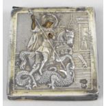 A Russian silver mounted miniature picture or icon, decorated in relief and depicting St.