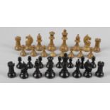 A late 19th century carved and stained boxwood chess set, largest piece 3 (7.5cm) high.