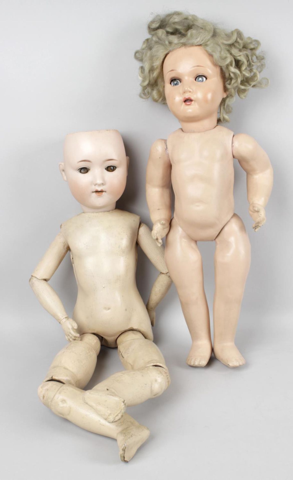 A collection of assorted dolls,