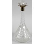 An early 20th century cut glass decanter and stopper,