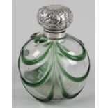 A large late Victorian silver mounted and glass dressing table scent bottle,