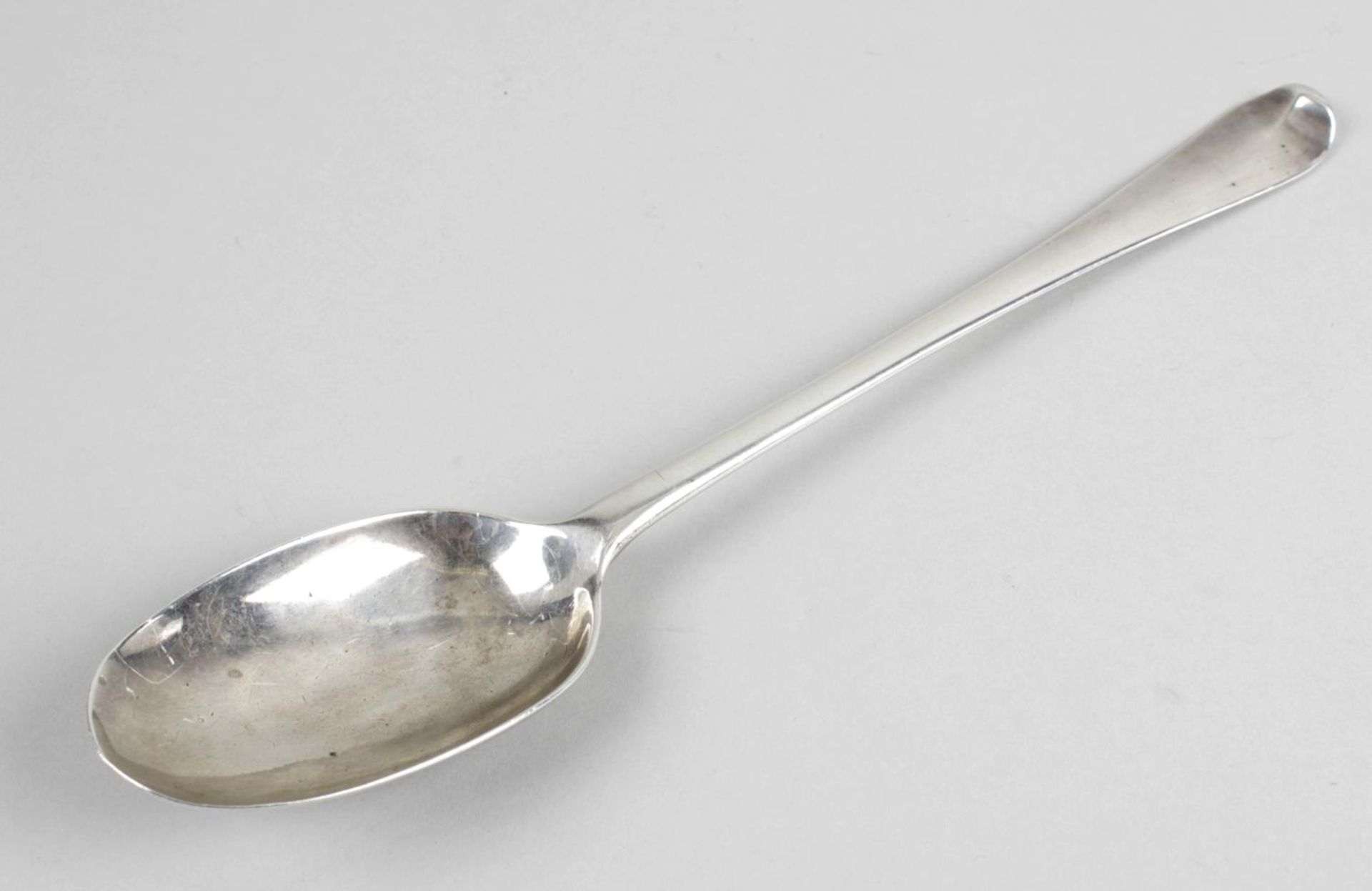 An early eighteenth century silver basting spoon,