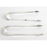 Two pairs of George III silver sugar tongs,