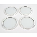 Three cased sets of four modern silver mounted glass coasters,