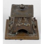 An Arts and Crafts hand beaten copper inkwell,