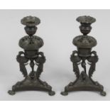 A pair of Regency bronze candlesticks,