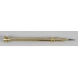 A unmarked gold push action pencil,