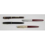 A group of fourteen assorted pens and pencils,