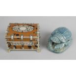 An unusual green glazed pottery desk weight modelled as a scarab,