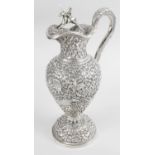 An Indian Kutch silver claret jug in the style of Oomersi Mawji,