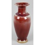 A Chinese pottery vase of tapered ovoid form the cylindrical neck with flared collar,