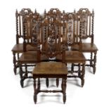 A late 19th century carved oak Jacobean style wind out extending dining room table,