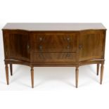 A reproduction mahogany veneered extending dining room table,