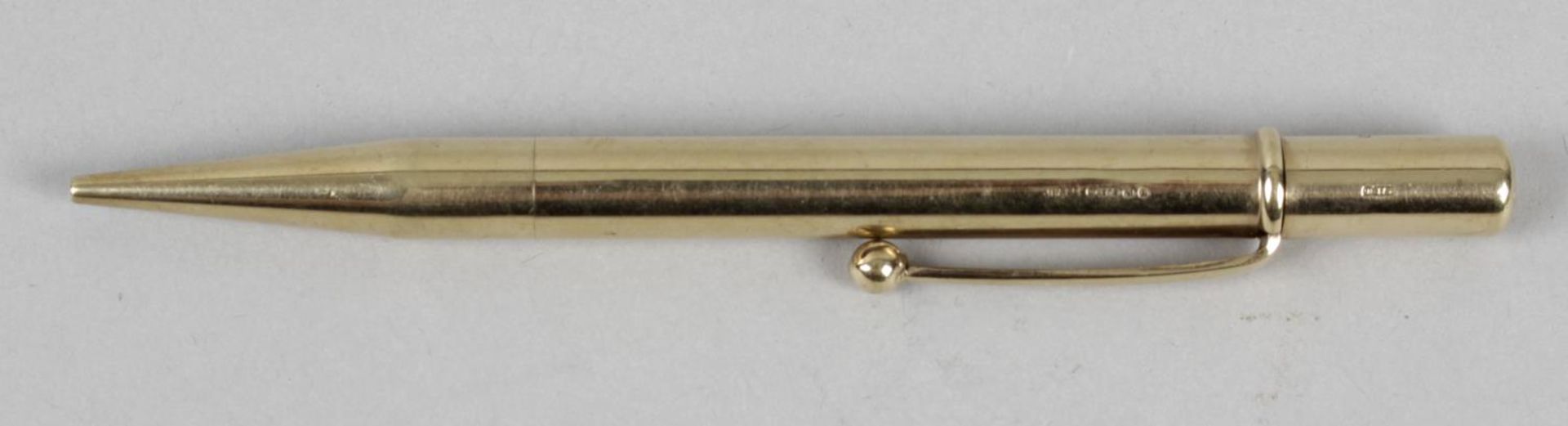 A 9ct gold propelling pencil, of plain cylindrical form, marked JM&Co 9 375, 4.25 (11cm) long.