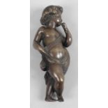 A 19th century bronze figure, modelled as a Putti in standing pose, 4 (10cm) high.